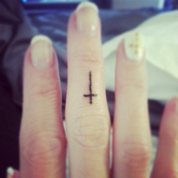 Black Cross Tattoo On Finger