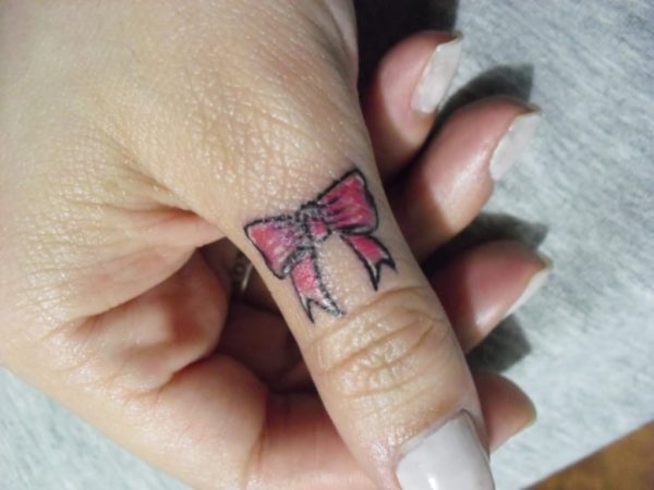 Bow Tattoo On Finger