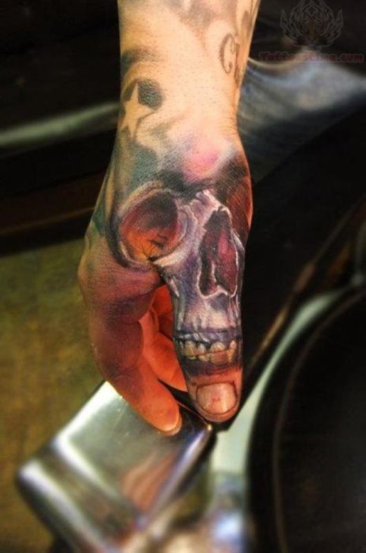 Colored Skull Tattoo On Thumb