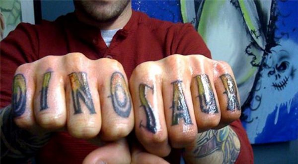 DINOSAUR Word Tattoo On knuckle