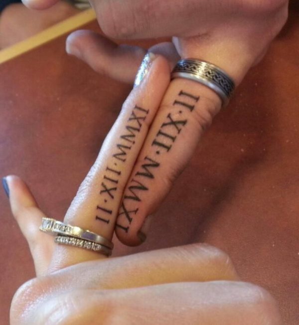 Dates Tattoo  on Finger