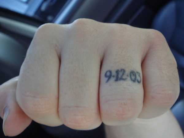 Dates Tattoo on Ring Finger