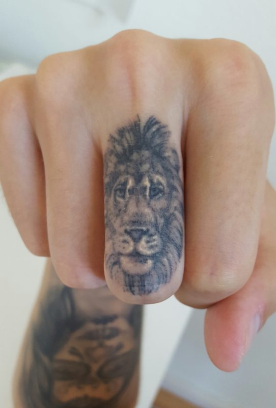 Grey Lion Tattoo on Finger