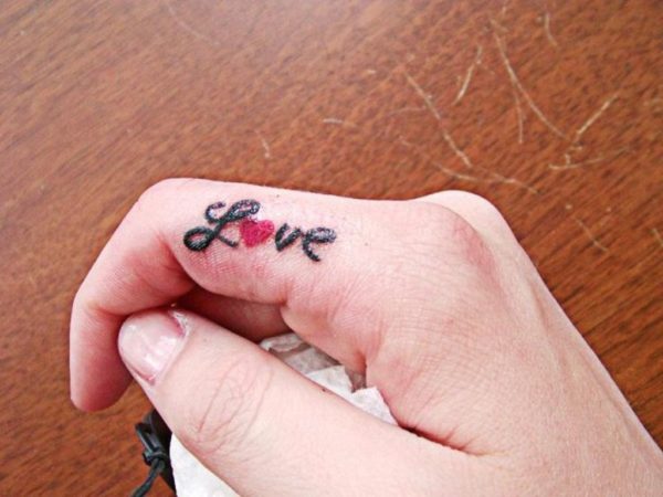 Love Word Tattoo On finger 