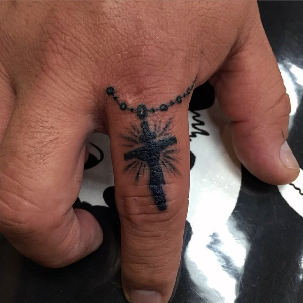 49 Elegant Cross Tattoos On Finger
