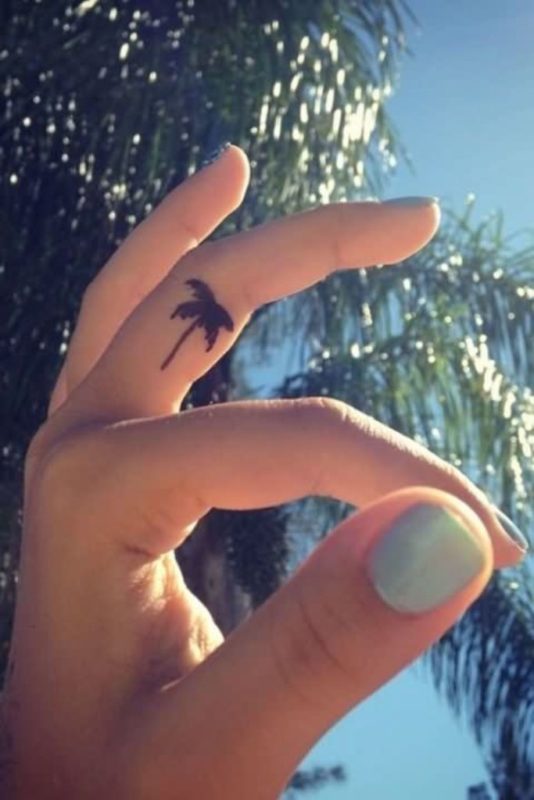 Small Black Palm Tree Tattoo On Finger