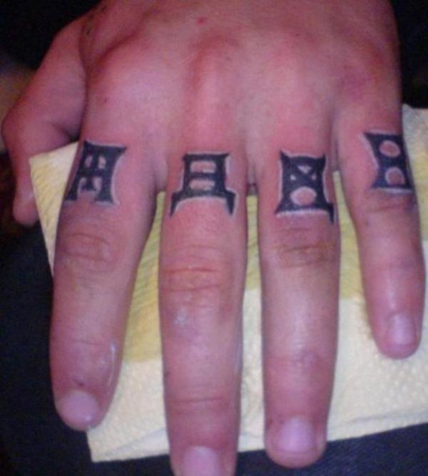 Symbols Tattoo On Fingers