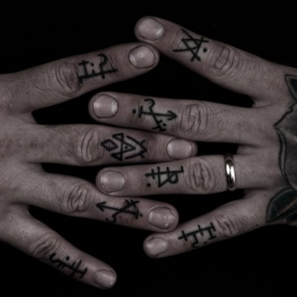 Symbols Tattoo On knuckle