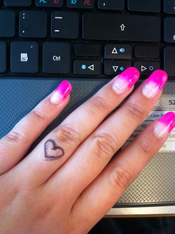 Tiny Heart Tattoo On Finger