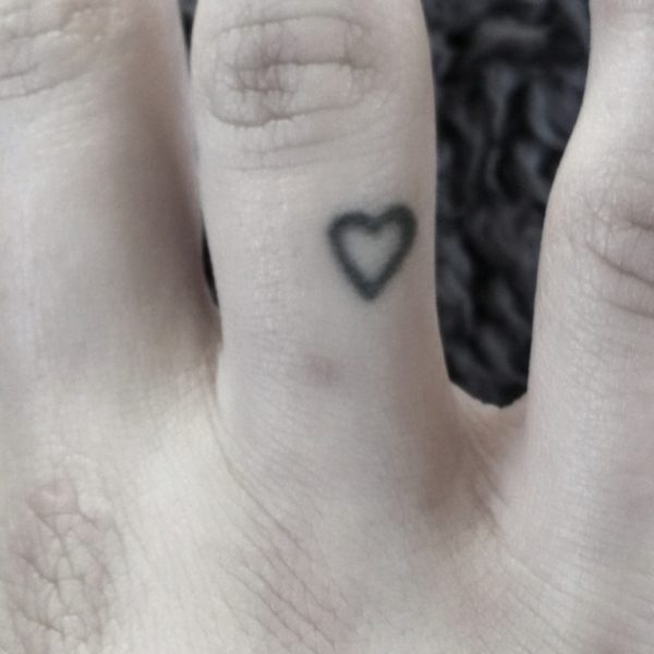 Tiny heart Tattoo On Finger