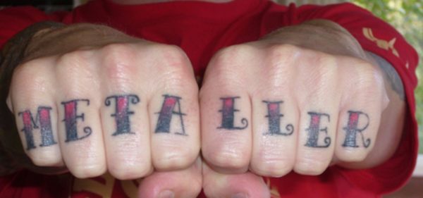 Metaller word Tattoo On knuckle