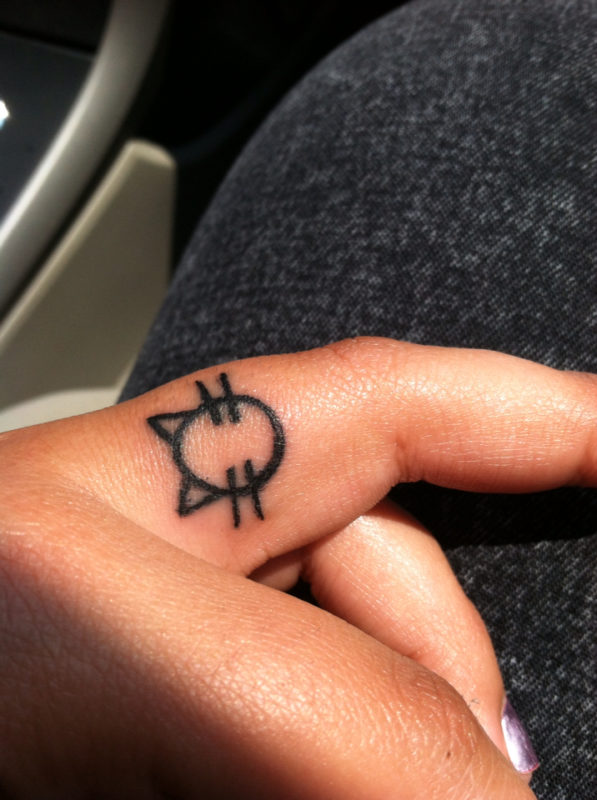 Adorable Cat Tattoo Design On Finger