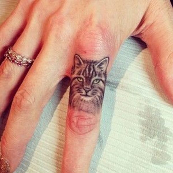 Adorable Cat Tattoo On Finger