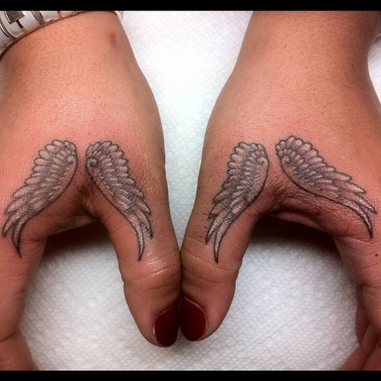 Adorable Feather Tattoo On Thumb