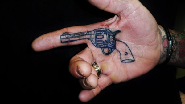 Adorable Gun Tattoo On Finger