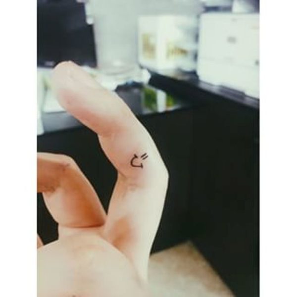 Adorable Smile Tattoo On Finger