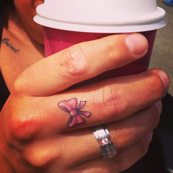 Amazing Pink Bow Tattoo On Finger