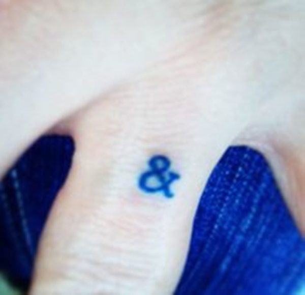 Ampersand Tattoo On Middle Finger