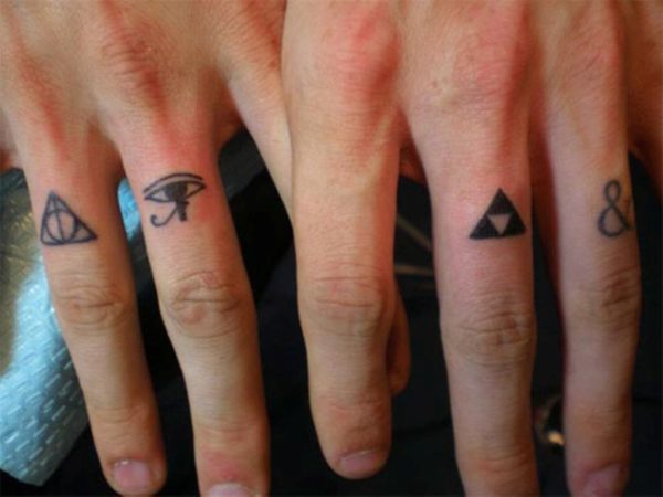 Ampersand Tattoo On Ring Finger