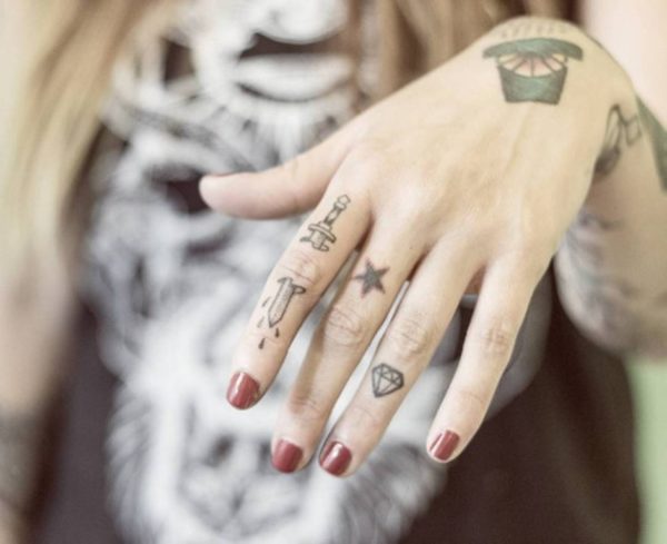 Attractive Sword Tattoo On Finger