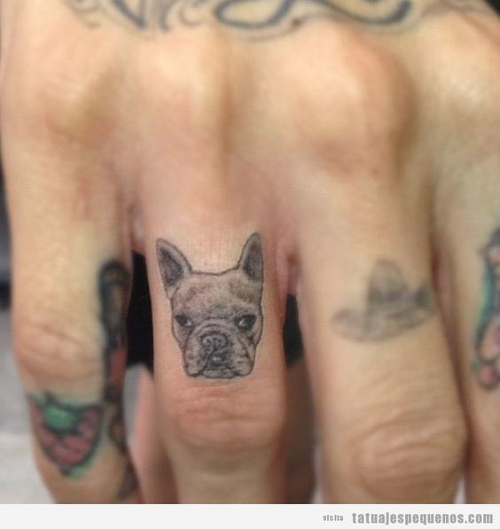 Attractive Dog Face Tattoo On Finger
