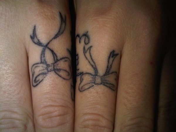 Black Bow Finger Tattoo