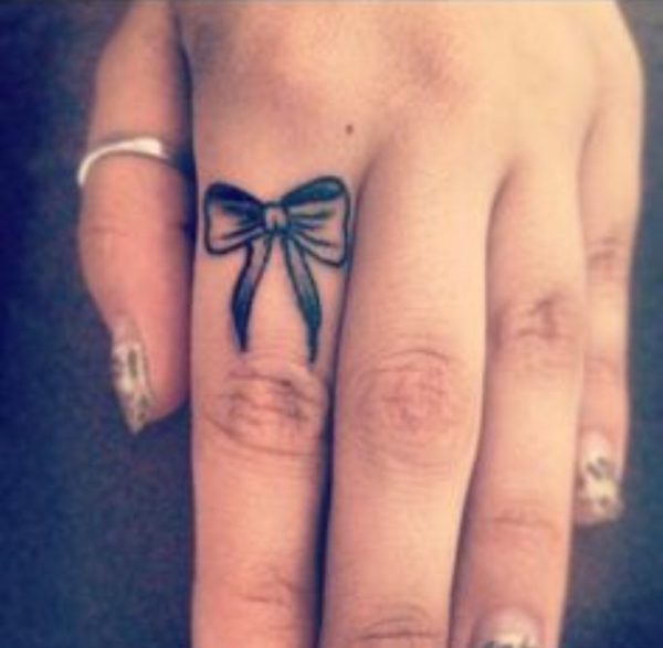 Black Bow Tattoo On Finger