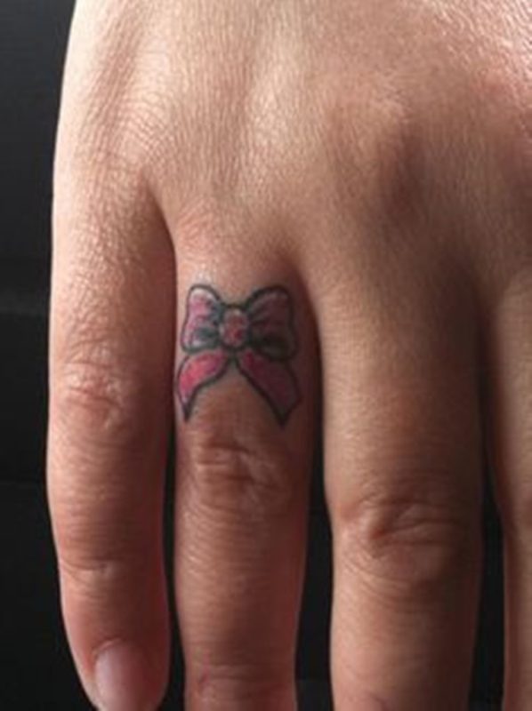 Bow Tattoo On Ring Finger
