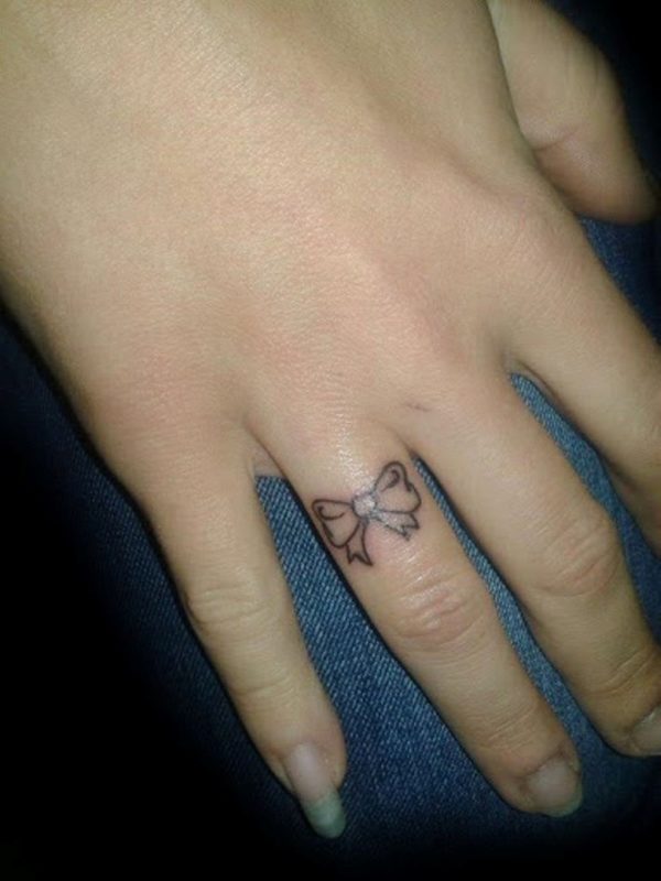 Bow Tattoo On Ringer Finger