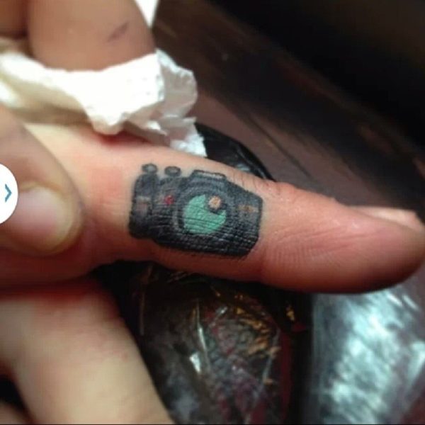 Colored Camera Tattoo On Finger