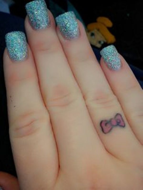 Cute Bow Tattoo On Finger