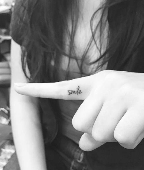 Cute Little Smile Tattoo On Finger