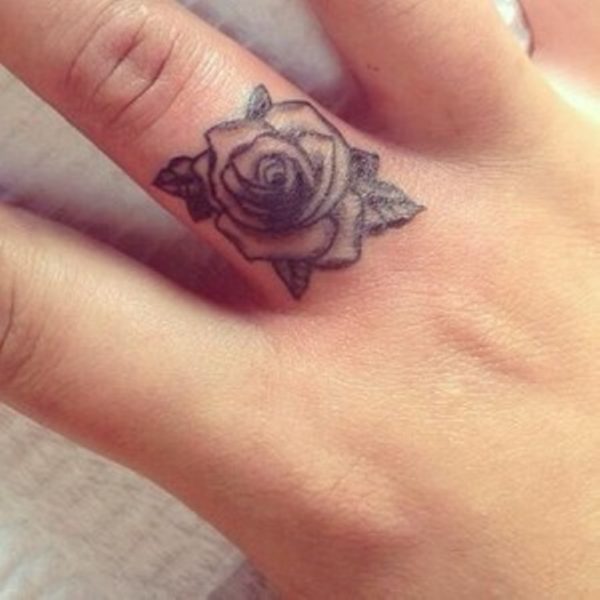 Cute Rose Tattoo On Middle Finger