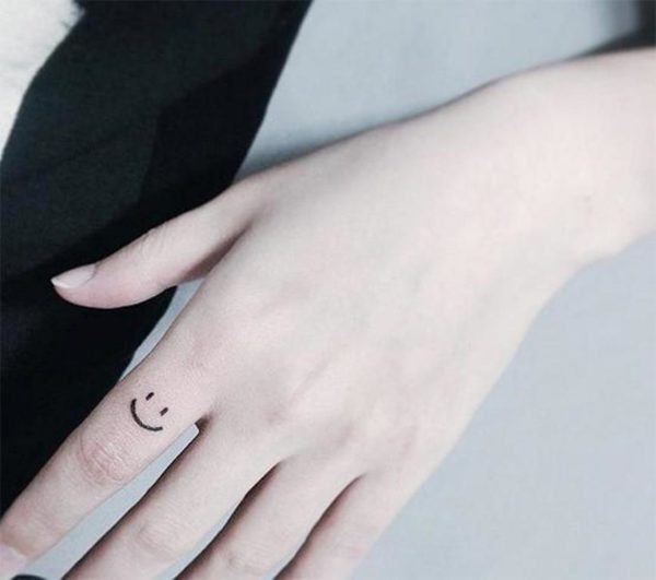 Cute Smile Symbol Tattoo On Finger