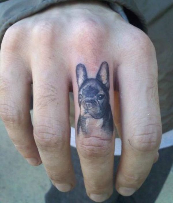 Dog Face Tattoo On Middle Finger