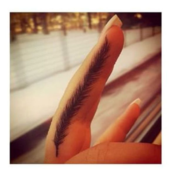 Feather Tattoo On First Finger