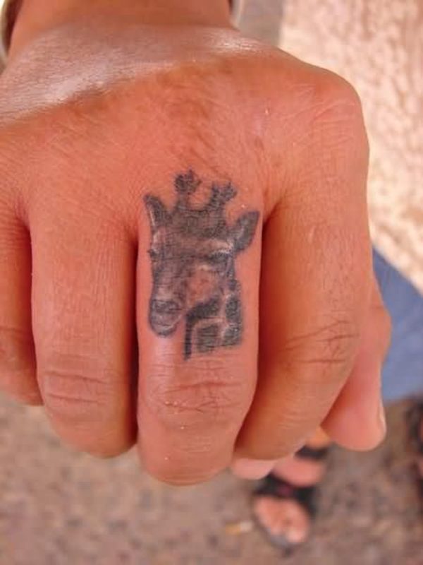 Giraffe Head Tattoo On Middle Finger