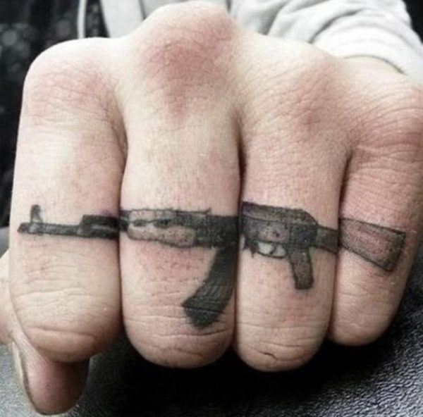 Nice Gun Tattoo On Finger
