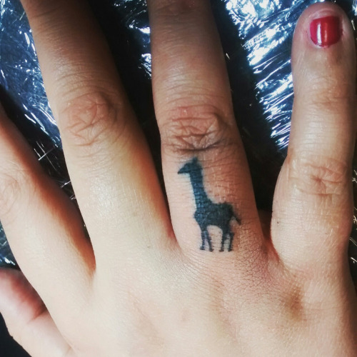 Giraffe Tattoo On Ring Finger