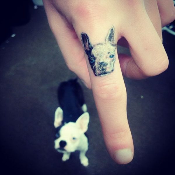 Lovely Dog Tattoo On First Finger