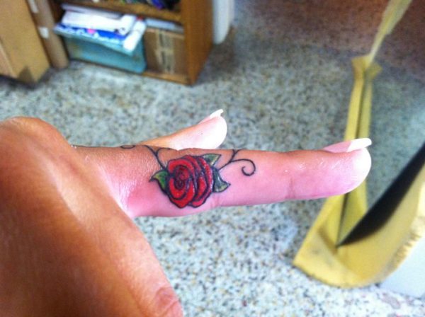 Lovely Red Rose Tattoo On Finger