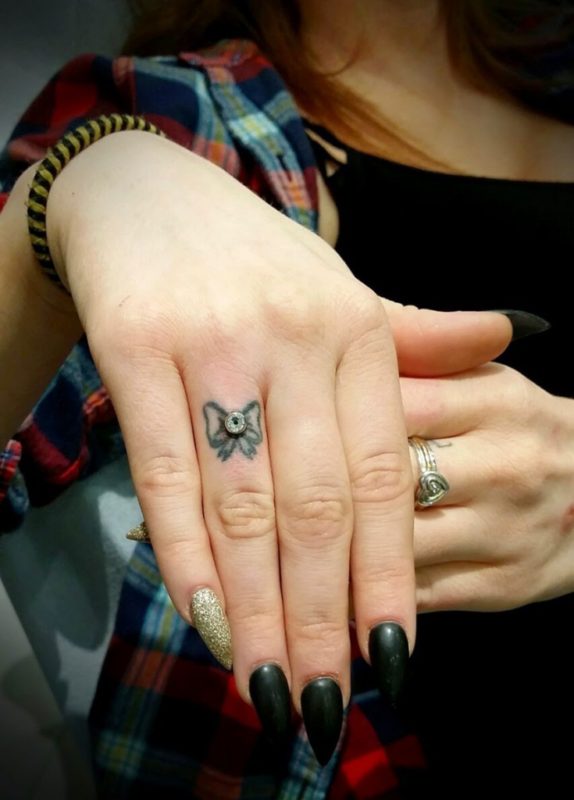 Nice Bow Tattoo On Finger