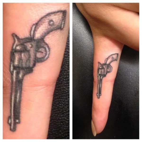 Nice Gun Tattoo On Finger