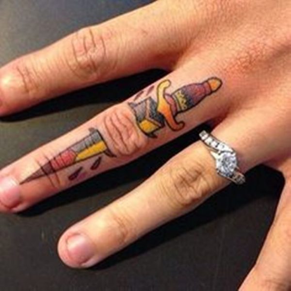Ripped Skin Sword Tattoo On Finger