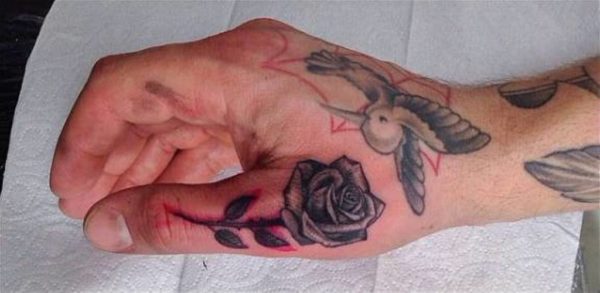 Rose Tattoo On Thumb