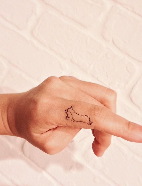 Running Dog Tattoo On Finger