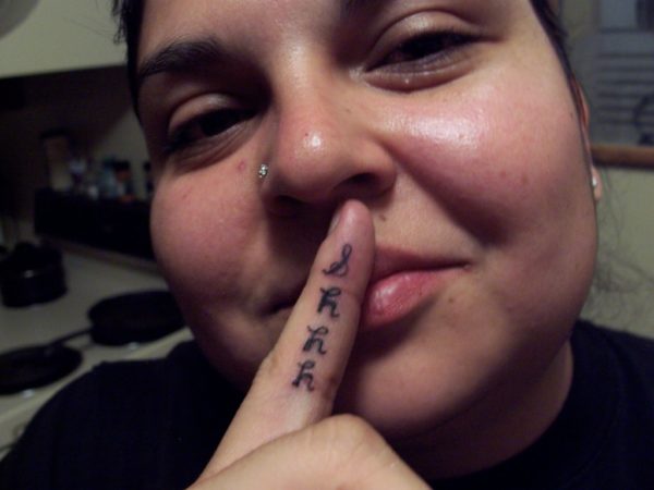 Shhh Tattoo On Finger 