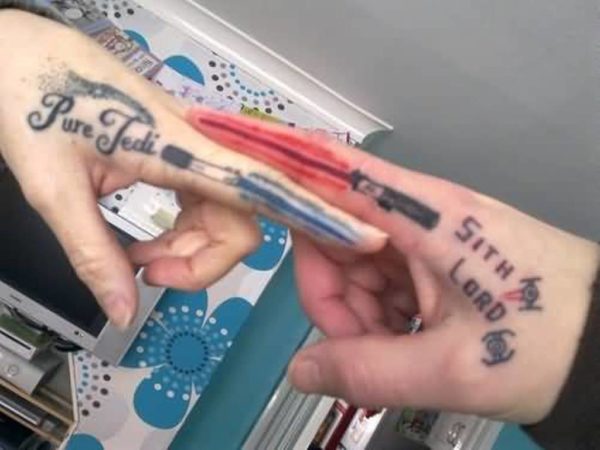 Simple Sword Tattoo On Finger