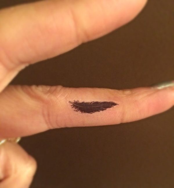 Small Feather Tattoo On Finger