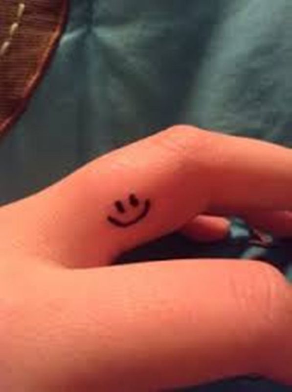 Smile Symbol Tattoo On Finger
